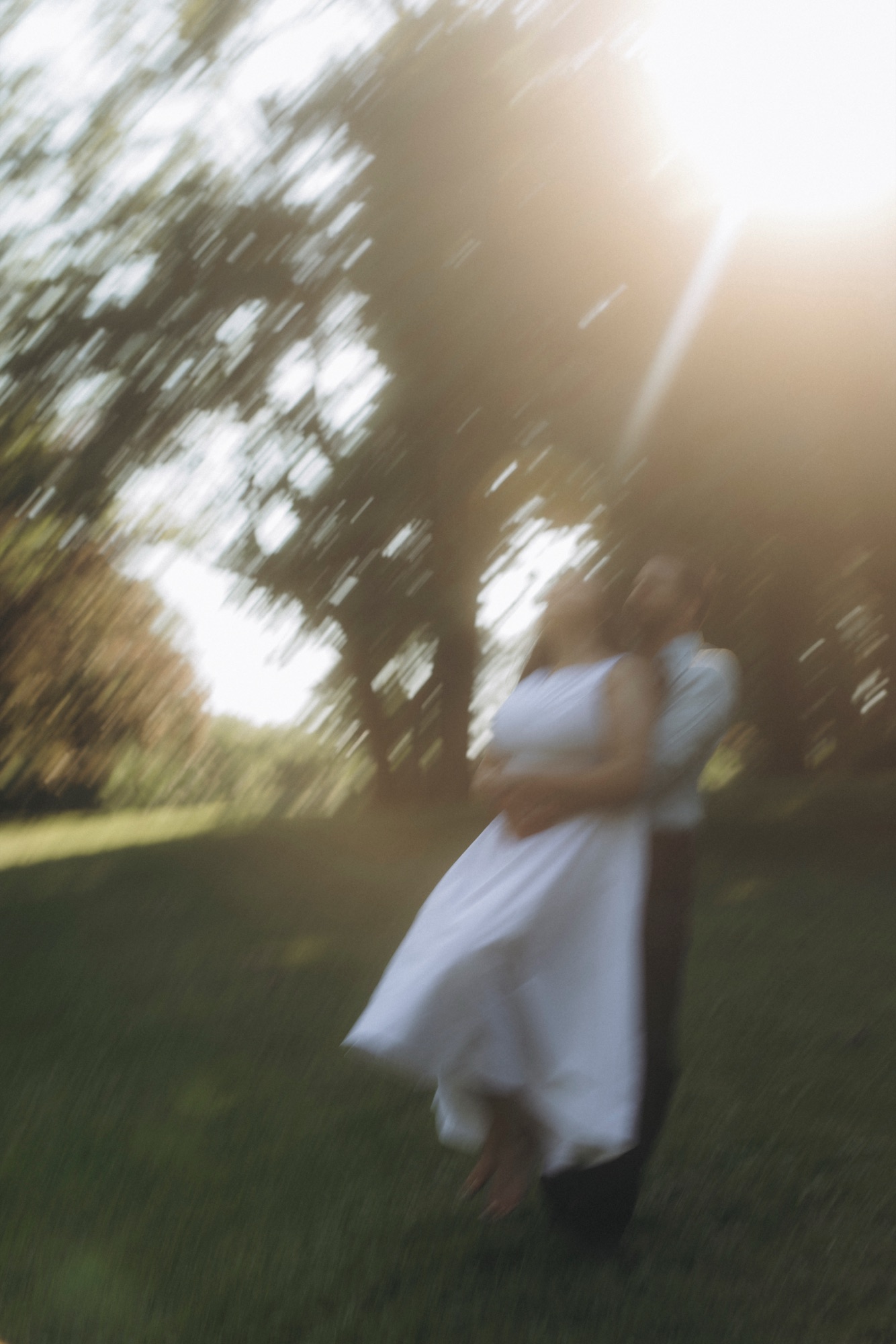 Bride twirling a gold gown under cherry blossoms by Lake Ontario, pre-wedding shoot styled by Bhoomi Jani Weddings