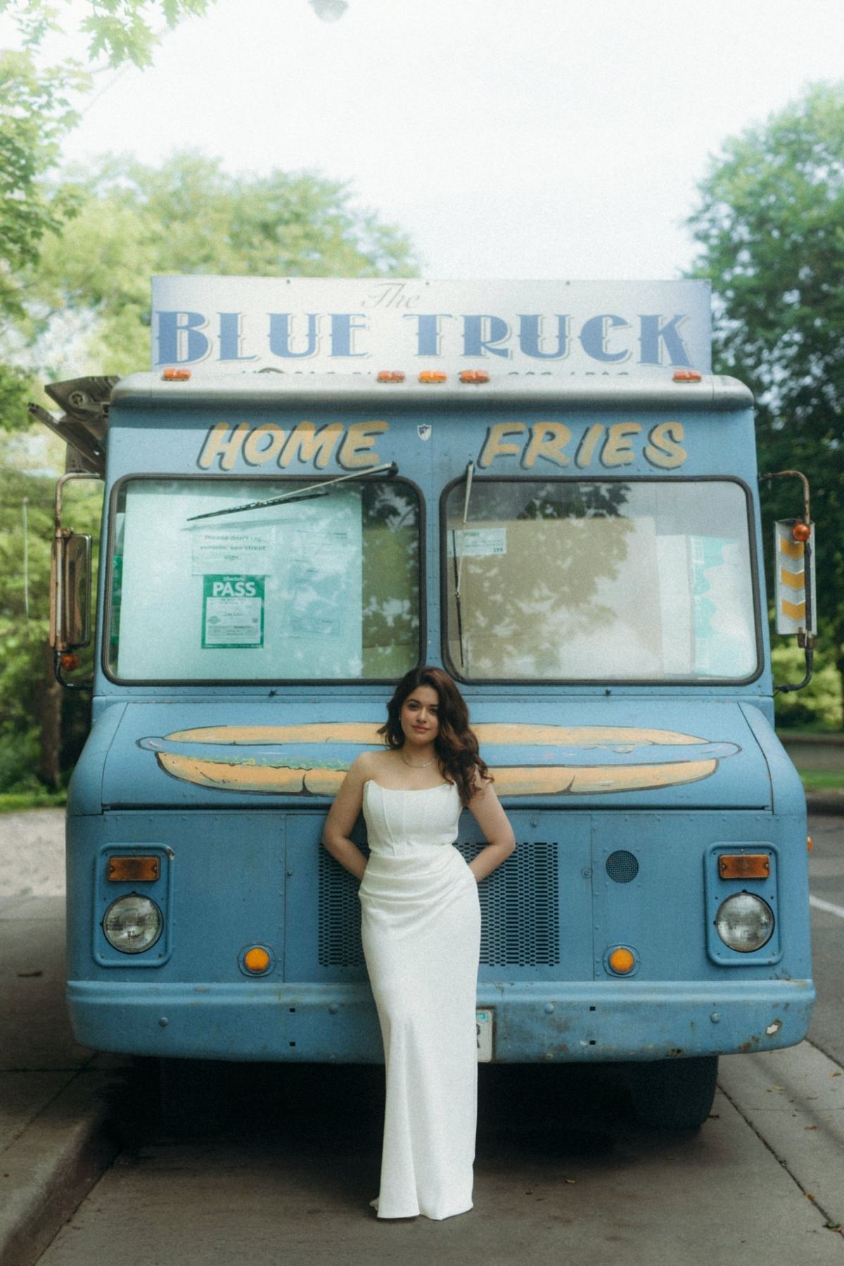 Manpreet in a white strapless gown against a vintage blue food truck, e-shoot styling by Bhoomi Jani Weddings